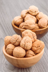 Walnuts on rustic wooden table