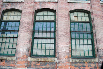 Obraz premium Barred Windows on a City Building