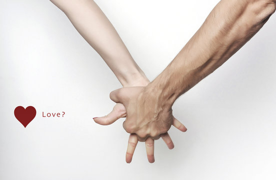 Man hand grasping woman hand, love?