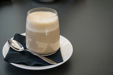 Freshly made coffee latte on a cafe table in Italy