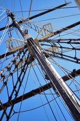 Fototapeta premium Masting of big wooden sailing ship, detailed rigging without sails