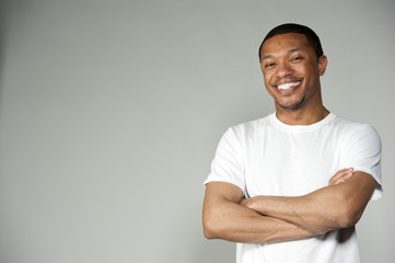 Trendy Happy and Fun Black Male Wearing A White Top