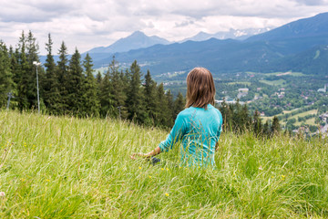 Woman Meditate at the Mountains