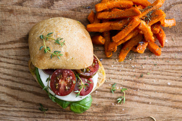 fresh mozzarella tomato sandwich with basil - Powered by Adobe