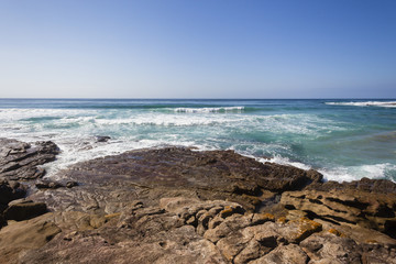 Ocean Rocky Coastline with blue water waves landscape