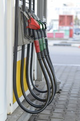 Fuel nozzles at a gas station.