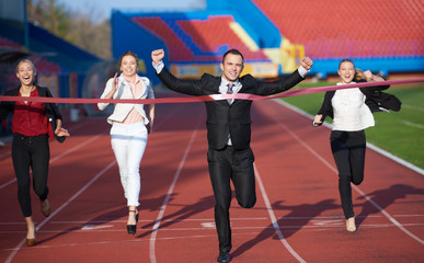 business people running on racing track