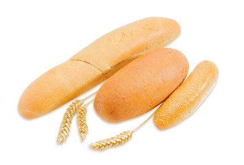 Various bakery products and three spikes on a light background