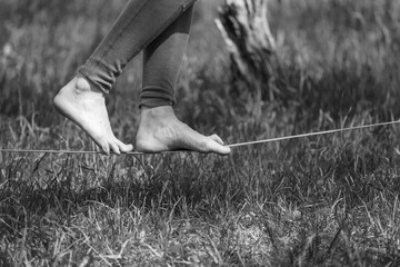Girl walking on slackline