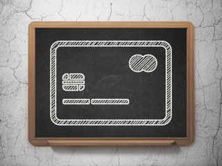 Money concept: Credit Card on chalkboard background