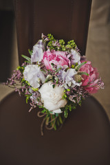 A bouquet of wedding flowers on the chair 3737.