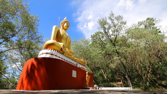 Time lapse of Golden buddha statue in public temple , Wat Kao By Sre , Chonburi Province Thailand
