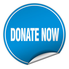 donate now round blue sticker isolated on white