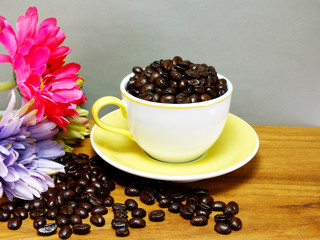 studio shot of coffee beans on wooden background still life