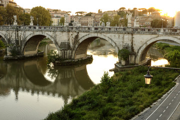 Fototapeta premium Ponte Sant'Angelo in Golden Sunset Light in Rome Panorama