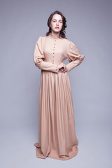 Fototapeta premium Portrait of young woman in retro dress