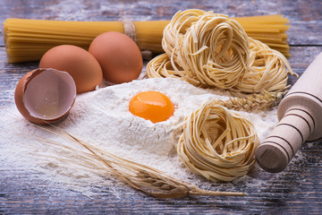  Ingredients for cooking pasta  on a wooden background