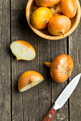 halved fresh onion on wooden table