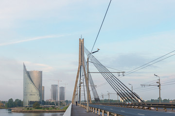 Cable bridge in the center of Riga city. Riga is the capital and largest city of Latvia, a major commercial, financial, cultural, historical and tourist center of the Baltic region
