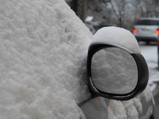 snowy driving mirror snowy grey car