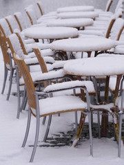 snowy chairs tables winter