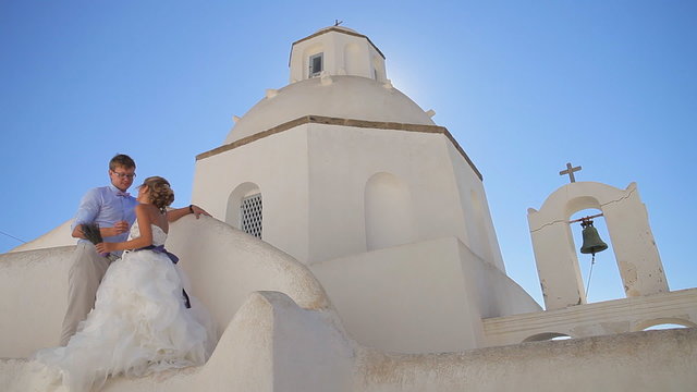 Beautiful bride and groom posing at camera