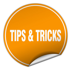 tips & tricks round orange sticker isolated on white