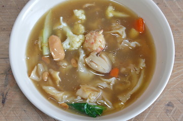 vegetarian fried rice noodle with gravy sauce in bowl