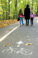 Family walking in autumn park