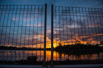 Sunrise at the lakeside fence and eliminate freedom.