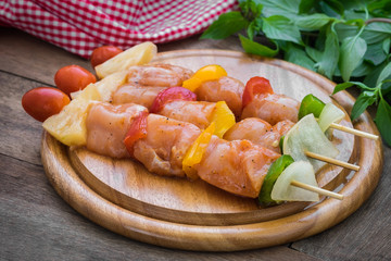 Raw barbecue on wooden cutting board