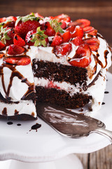 Chocolate cake with whipped cream and strawberries.selective focus
