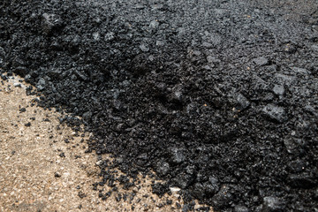 Close-up asphalt at the road under construction.
