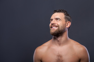 Fototapeta premium Cheerful naked guy with beard and smile