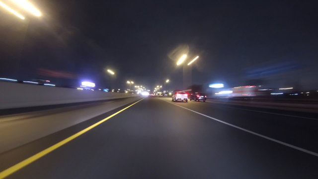Freeway Driving Night Toronto Timelapse. Driving down the Gardiner Expressway, Queens Expressway and Hurontario Street at night from Toronto to Mississauga, Ontario, Canada. Shot in Time-lapse.