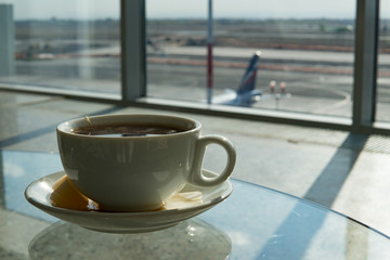 Cup of tea in airport business lounge while waiting for the flight