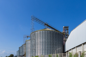 Beautiful blue sky and big tanks factory