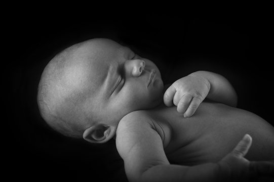 Sleeping Newborn Baby with black background