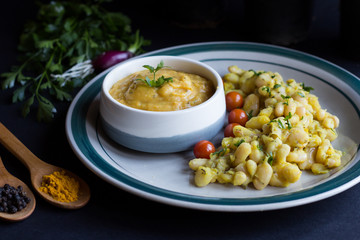 white beans and beans soup, with cherry tomato, and curcuma.