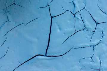 dry blue paint with crack 

