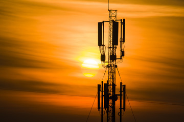 TV antenna on a background of a sunset