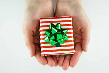 Christmas present in hands isolated