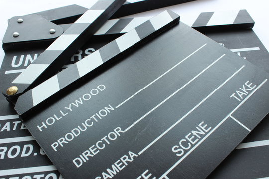 closeup clapper and movie start in the cinema. camera lens under light and clapperboard for cinema education. Space for text.