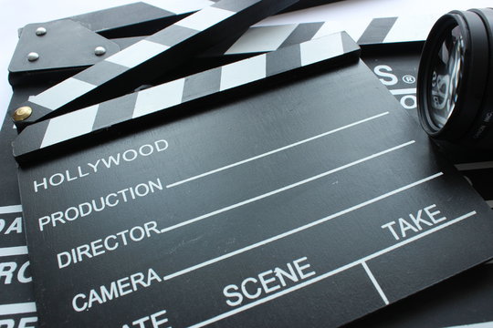 clapper and objective in the cinema for movie school and movie workshops. Space for text.