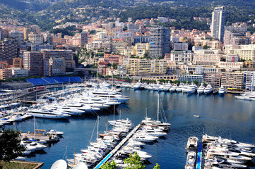 View to Monte Carlo bay with the row of yachts piers and hotels.  