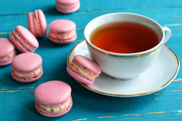 Obraz na płótnie Canvas French Macarons with a cup tea