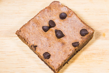 Homemade brownies sliced and  topping on  wooden background