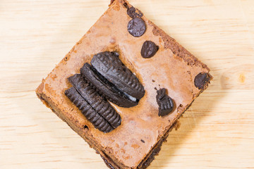 Homemade brownies sliced and  topping on  wooden background