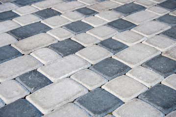 Urban road is paved with blocks of stone