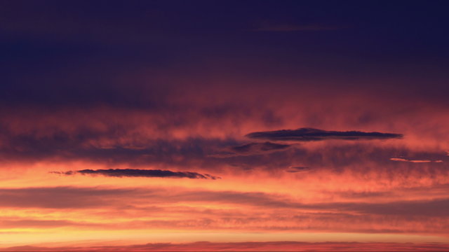 Clouds Dusk Sunset Timelapse. Richly colored clouds during sunset. Shot in time lapse. Rendered in UltraHD 4K from high resolution stills.
